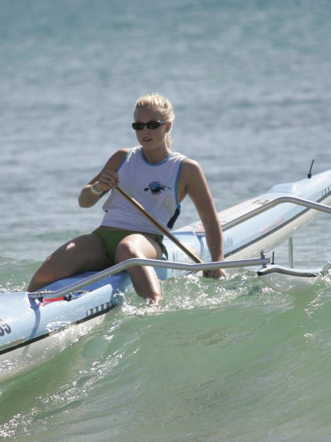 Jaimi Kenny in 2007 rides into the shore at the outriggers championships. Picture: Chris McCormack