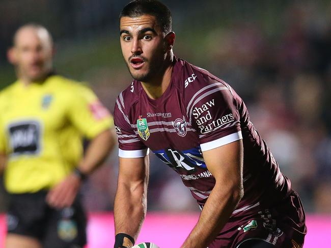 Tom Wright of the Sea Eagles looks to pass against the Storm at Brookvale Oval.