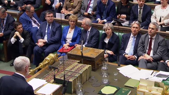 Britain's Prime Minister Theresa May listens as Labour Party Leader Jeremy Corbyn speaks in the House of Commons. Picture: AFP