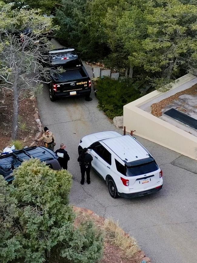 Authorities swarmed their home after the grim discovery was made. Picture: AP