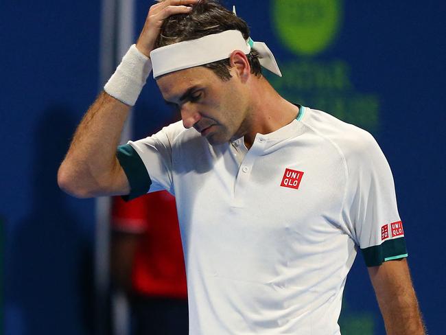 A handout picture obtained from the Qatar Tennis Federation on March 11, 2021, shows Roger Federer reacting during his match with Nikoloz Basilashvili of Georgia at the Qatar ExxonMobil Open at the Khalifa International Tennis and Squash Complex in the Qatari capital Doha. - Federer squandered a match point and was knocked out of the Qatar Open by Basilashvili in just his second match since a 13-month injury absence. (Photo by Samer Al-Rejjal / Qatar Tennis Federation / AFP) / RESTRICTED TO EDITORIAL USE - MANDATORY CREDIT "AFP PHOTO / QATAR TENNIS FEDERATION " - NO MARKETING - NO ADVERTISING CAMPAIGNS - DISTRIBUTED AS A SERVICE TO CLIENTS