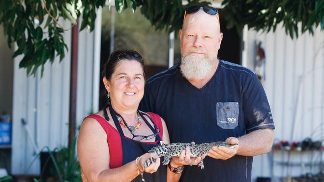 Croc farm owners Wayne Kinbacher and Charmaine Carter have about 1500 crocs in the Darwin rural area. Picture GLENN CAMPBELL