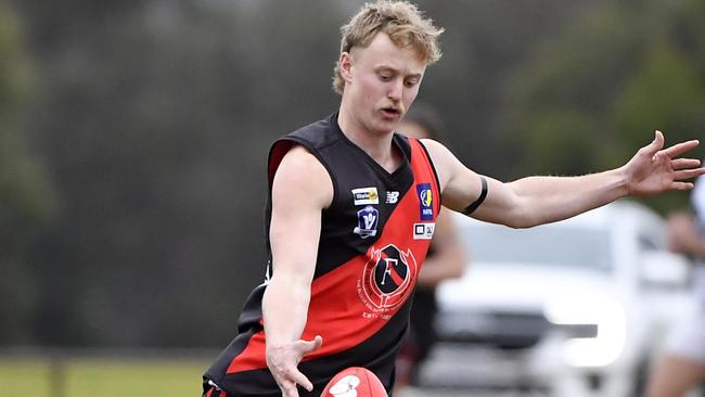 Mitchell Charles takes a kick for the Frankston Bombers. Picture: Andrew Batsch