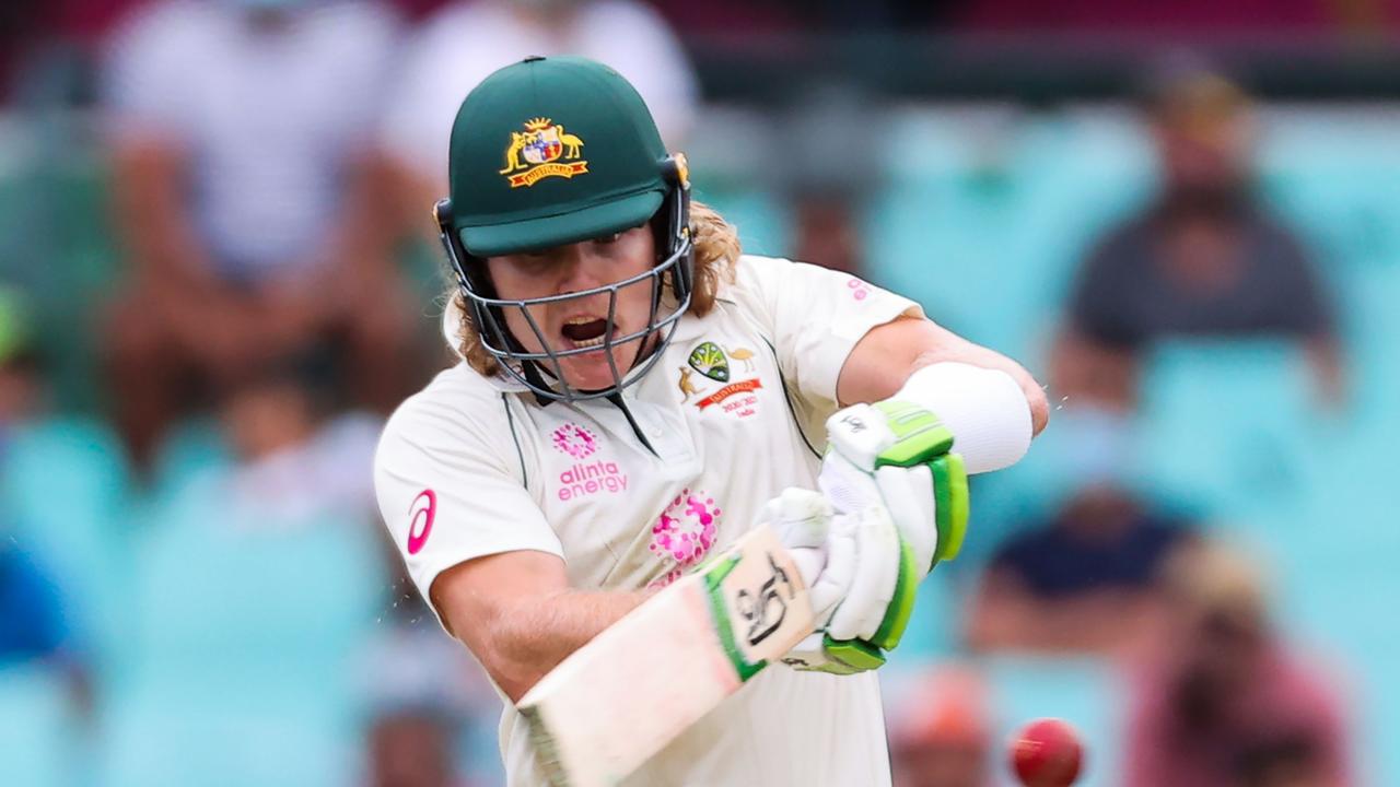 TOPSHOT - Australia's Will Pucovski plays a shot during the first day of the third cricket Test match between Australia and India at the Sydney Cricket Ground (SCG)in Sydney on January 7, 2021. (Photo by DAVID GRAY / AFP) / -- IMAGE RESTRICTED TO EDITORIAL USE - STRICTLY NO COMMERCIAL USE --