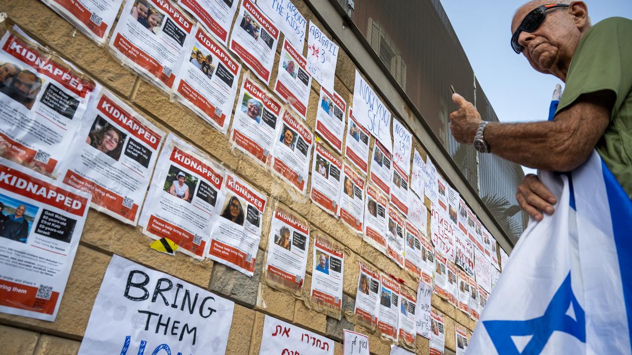 People put up fliers and signs with the names and faces of people kidnapped, during a protest against the Netanyahu government, calling for his resignation and to bring home the kidnapped people. Picture: Alexi J. Rosenfeld/Getty Images