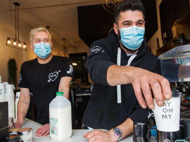 Adam Zeineddine (R), owner of Swan Street cafe My Oh My and barista Andy Balloch adopted the use of masks early. The Victorian Government announced today that face coverings in public will be mandatory From Wednesday night in the Greater Melbourne and Mitchell Shire.Photograph by Paul JeffersThe Australian19 July 2020