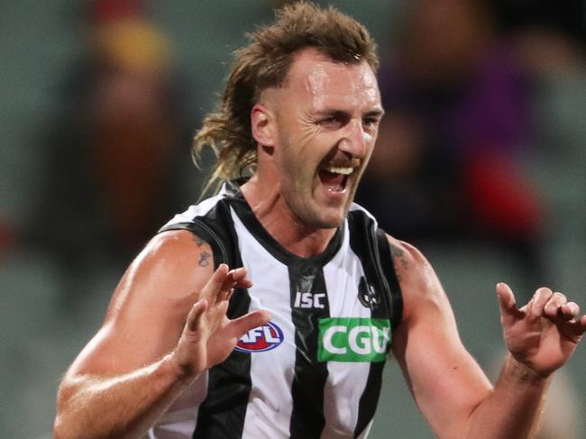 ADELAIDE, AUSTRALIA - AUGUST 11: Lynden Dunn of the Magpies celebrates a goal during the 2020 AFL Round 11 match between the Adelaide Crows and the Collingwood Magpies at Adelaide Oval on August 11, 2020 in Adelaide, Australia. (Photo by Matt Turner/AFL Photos via Getty Images)