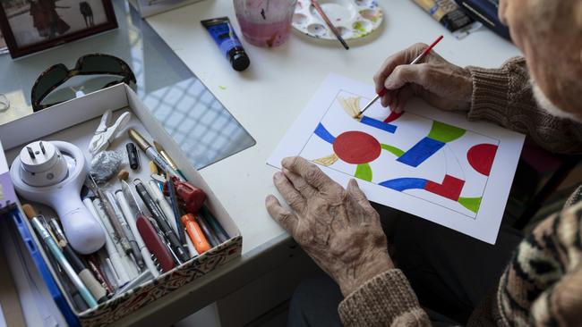 Marc at work on one of his geometric paintings. Picture: Russell Shakespeare