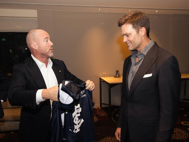 Luke Sayers presented NFL star Tom Brady with a Carlton jumper during a function at Crown in January. Picture: @the.cwolf, Joshua Scott