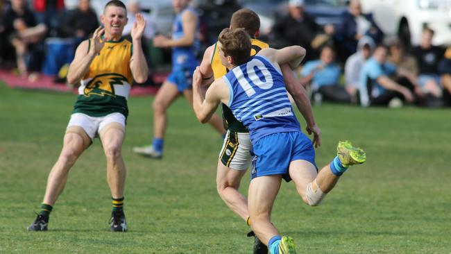 SHOC’s Cameron Rankin tackles Salisbury North's Dion Lawlor on Saturday. Picture: AAP/Russell Millard