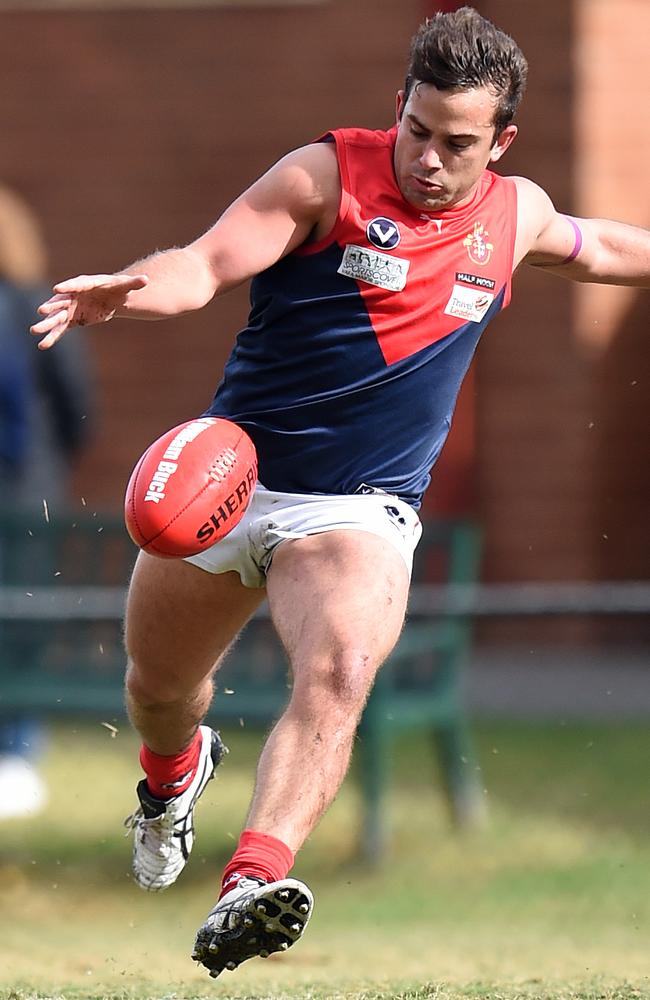 Michael Karayannis gets a kick. Picture: Jason Sammon