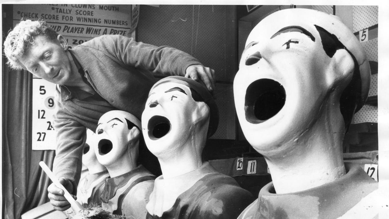 Royal Adelaide Show 1970. Only a week to go to the show and Mr. G. Blainey of Victoria has his clown face sideshow ready.