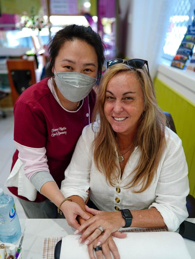 Tammy’s Nails, Spa and Beauty employee May Her and Kewarra Beach resident Melynda Franstedt know why it’s good to splurge. Picture: Nuno Avendano