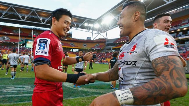 Queensland’s Japanese international fullback Ayumu Goromaru shakes hands with Tusi Pisi after full time between the Reds and Sunwolves in Brisbane.