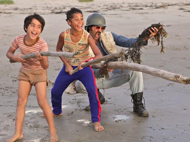 Rocky (Te Aho Eketone-Whitu), Boy (James Rolleston) and Alamein (Taika Waititi) playing war on the beach in a scene from New Zealand film Boy.