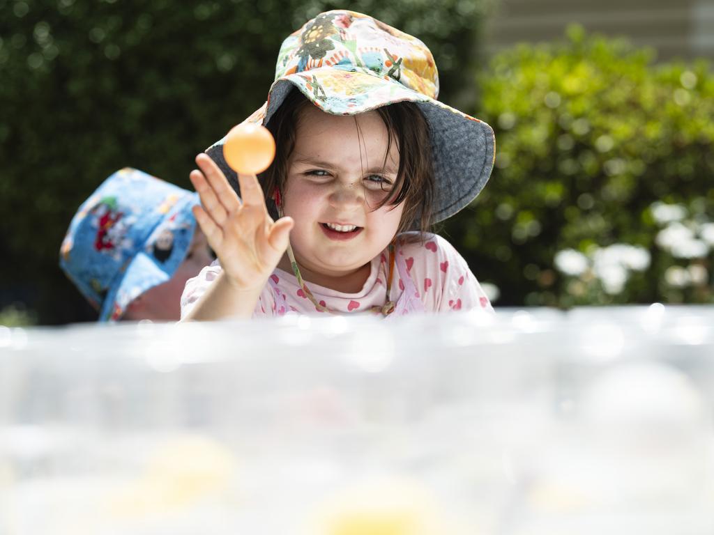 Posie Francis throws the ball to win in a game stall at the Fairholme Spring Fair, Saturday, October 19, 2024. Picture: Kevin Farmer