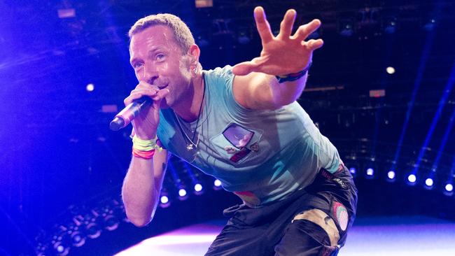 Chris Martin of Coldplay, pictured at the Glastonbury Festival in June 2024, is among the megastar musicians who accepts private gigs. Picture: Samir Hussein.