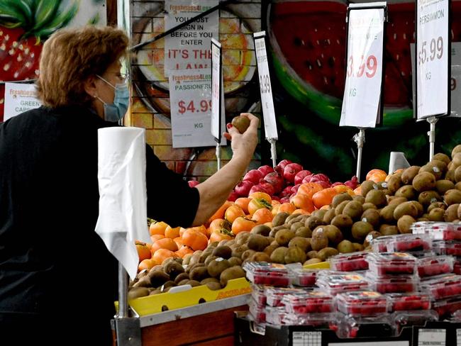 A woman shops at a market in a suburb of western Sydney on April 27, 2022. - Australia's annual inflation rate hit 5.1 percent in the March quarter, the highest recorded since 2001, according to official data released on April 27. (Photo by Saeed KHAN / AFP)