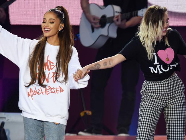Singers Ariana Grande and Miley Cyrus perform at the One Love Manchester tribute concert in Manchester, north western England, Sunday, June 4, 2017. Picture: Dave Hogan/AP