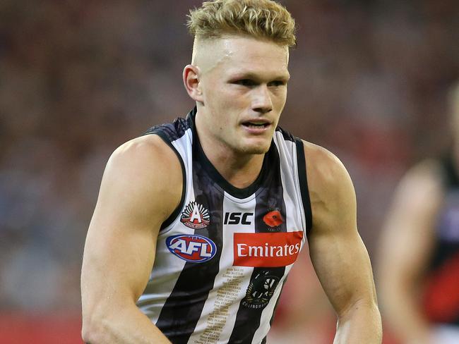 AFL Round 5. 25/04/2018. Collingwood vs Essendon at the MCG.  Collingwood's Adam Treloar charges forward  . Pic: Michael Klein