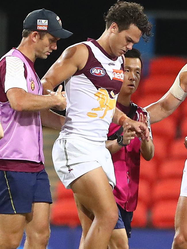 Cam Rayner limps from the field after suffering a serious knee injury.