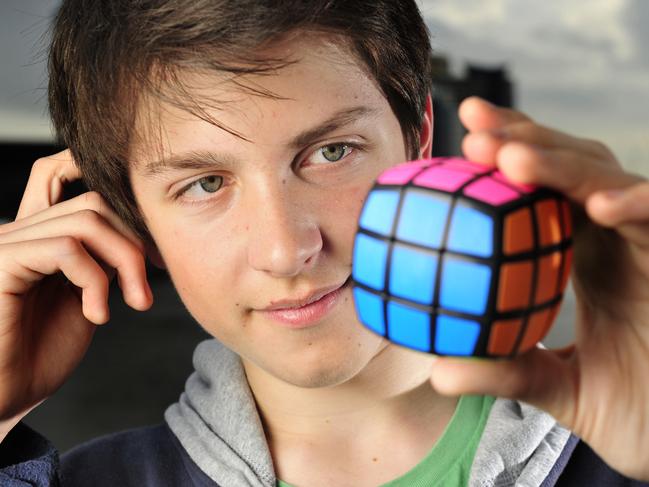 Cube Solver. 15 year old Feliks Zemdegs is the world record holder for Rubiks Cube solving. He is on display at the Reeds Gift Fare at the Melbourne Exhibition Centre.