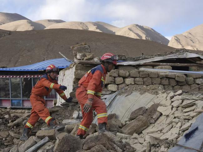 Search and rescue workers hunt for survivors in the aftermath of an earthquake in Changsuo Township. Picture: Xinhua via AP