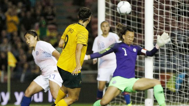 Foord scores her first with a blast into the roof of the net. (AAP Image/Darren Pateman)