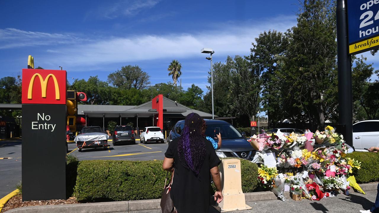 Members of the community arrive to lay a floral tribute where paramedic Steven Tougher was killed on Friday. Picture: NCA NewsWire / Jeremy Piper