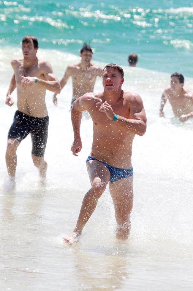 Rhys King running out of the water during the Southport Sharks VFL team’s preseason training camp at Tallebudgera Beach. Picture: Mike Batterham