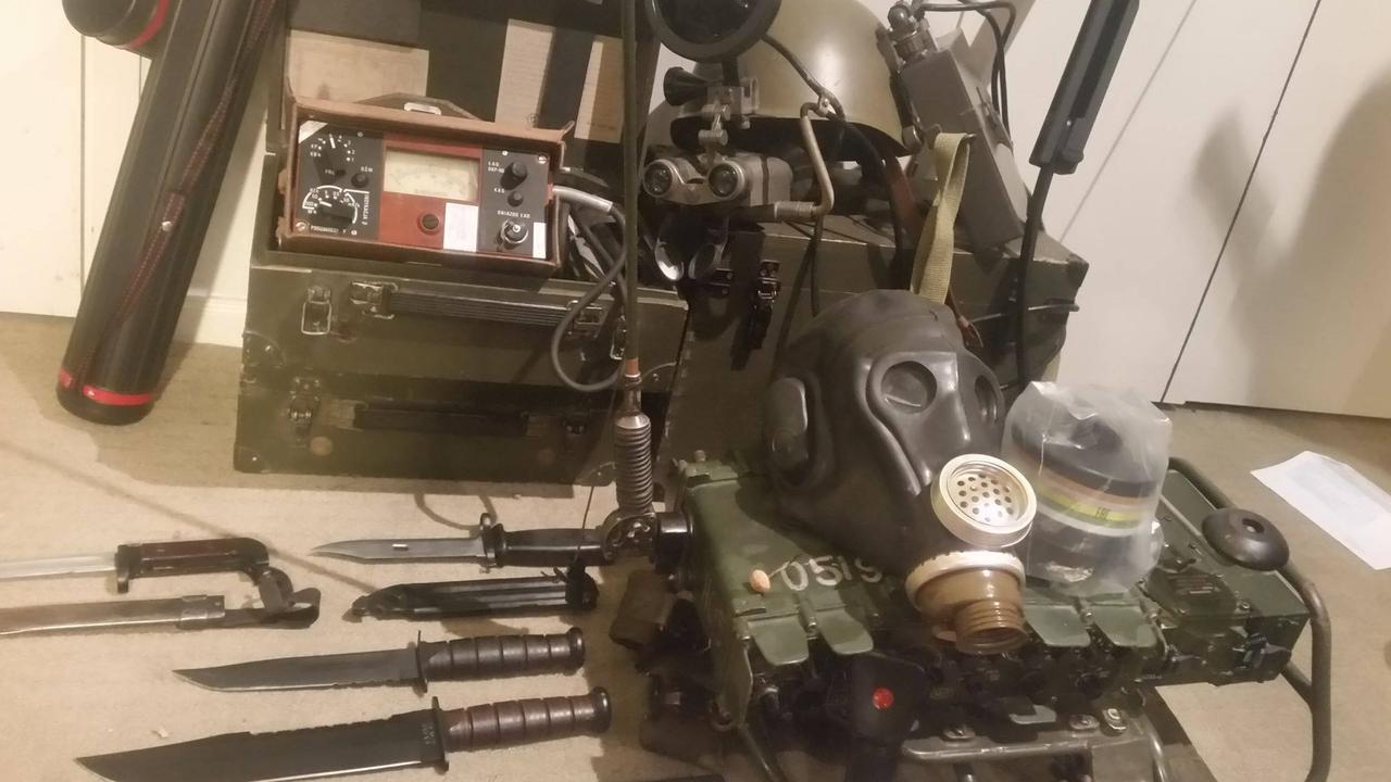 Red's survival gear includes a folding bow, quiver for holding arrows, gas mask, PRC-320 radio transceiver, night vision infra-red goggles and a highly sensitive radiation meter.