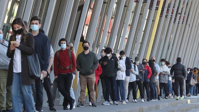 Melburnians line up to get their Covid vaccinations at the Melbourne Exhibition Centre. Picture: NCA NewsWire / David Crosling