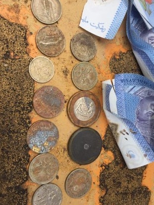 Australian and Malaysian money was found among the items on a Penang construction site. Picture: Supplied