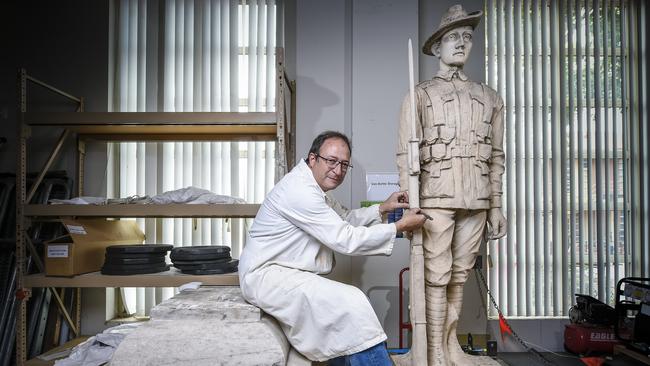 The Blackwood War memorial at Artlab in the city with restorer Ian Miles. Pic. (AAP ROY VANDERVEGT