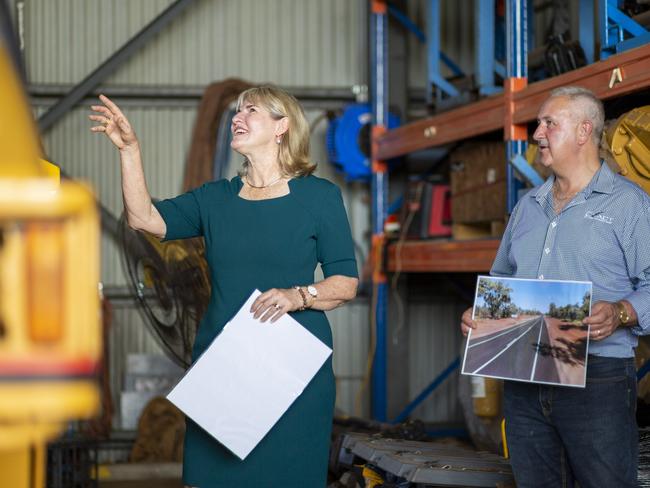 Infrastructure, Planning and Logistics Minister Eva Lawler and Exact Contracting safety, training and quality manager Jeff Rotman. Picture: Floss Adams.