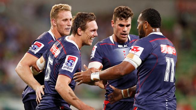 MELBOURNE, AUSTRALIA - FEBRUARY 23:  Dane Haylett-Petty of the Rebels celebrates a try with teammates during the round two Super Rugby match between the Melbourne Rebels and the Queensland Reds at AAMI Park on February 23, 2018 in Melbourne, Australia.  (Photo by Daniel Pockett/Getty Images)