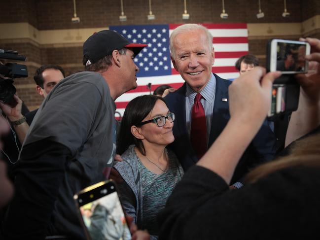 DAVENPORT, IOWA - OCTOBER 16: Democratic Presidential candidate former vice president Joe Biden greets guests during a campaign stop at the RiverCenter on October 16, 2019 in Davenport, Iowa. Biden spoke heavily about what he perceived as President Donald Trump's failures in foreign policy during the event. The 2020 Iowa Democratic caucuses will take place on February 3, 2020, making it the first nominating contest in the Democratic Party presidential primaries   Scott Olson/Getty Images/AFP == FOR NEWSPAPERS, INTERNET, TELCOS & TELEVISION USE ONLY ==