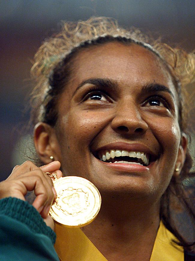 Nova Peris with the gold medal she won in women's 200m track final at the 1998 Commonwealth Games in Kualal Lumpur