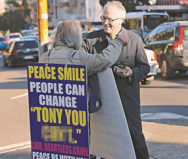 Danny Lim, pictured with the sign and MP Malcolm Turnbull.