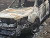 Officer injured, car destroyed after fire at jail