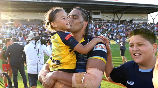 BRISBANE, AUSTRALIA - OCTOBER 10: Leivaha Pulu of the Devils celebrates victory with his family after the 2021 QRL Intrust Super Cup Grand Final match between the Norths Devils and the Wynnum-Manly Seagulls at Moreton Daily Stadium on October 10, 2021, in Brisbane, Australia. (Photo by Bradley Kanaris/Getty Images)