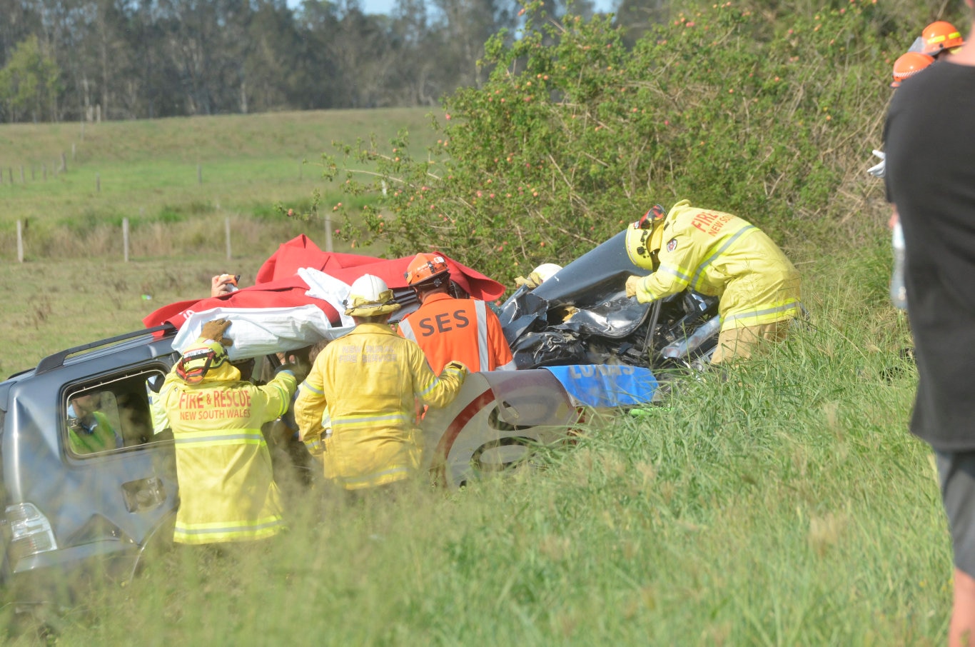 Emergency services attempt to remove a patient from one of the vehicles. Picture: Kathryn Lewis