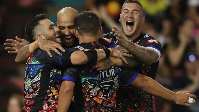 The Indigenous All Stars celebrate Ashley Taylor’s try.