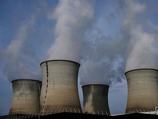 (FILES) This photograph taken on July 24, 2023, shows cooling towers at the Bugey Nuclear Power Plant in Bugey in the Saint-Vulbas commune, eastern France. Driven by a renewed interest in the atom, EDF intends to implement third-generation reactors (EPR) in France and Europe (Photo by Emmanuel DUNAND / AFP)