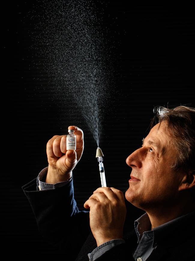 Flinders University Professor Nikolai Petrovsky sprays the test vaccine using a syringe with a nasal spray attachment. Picture Matt Turner.