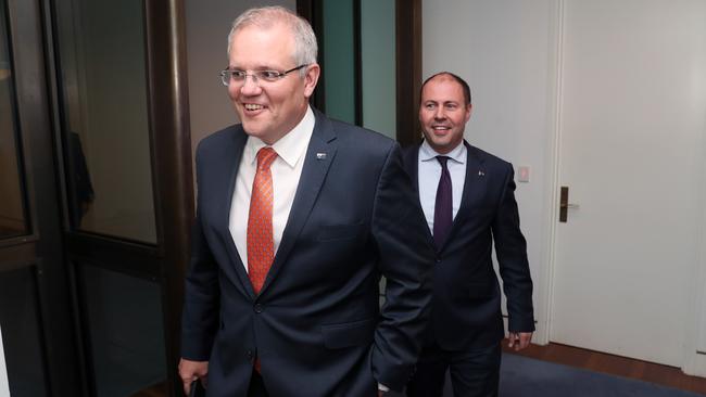 The Prime Minister and the Treasurer at the press conference at Parliament House on Monday night. Picture: Gary Ramage