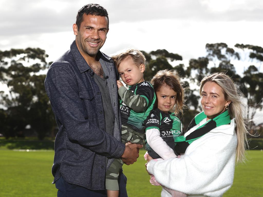 Retiring defender Nikolai Topor-Stanley celebrates his career with Kylie and Luna and Remy. Picture: Robert Cianflone/Getty Images