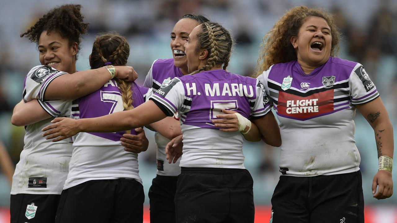 Warriors players celebrate victory during the round one Women's NRL match between the Sydney Roosters and the New Zealand Warriors.