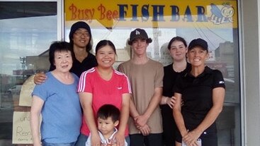 L to R: Lin and Andrew Wong, new owner Sandy Li with her son and the Nelson family – Hamish, Zoe and Lucinda.