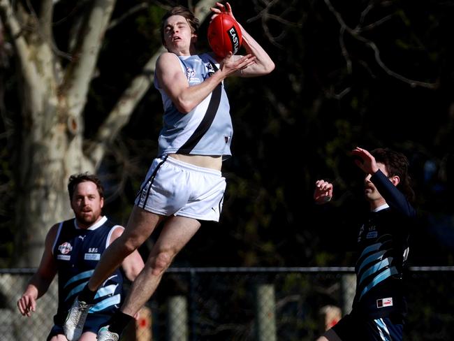 EFNL: Connor Cochrane flies high for Oakleigh District. Picture: Hamish Blair